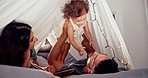 Home, parents and baby with fun, playing and games with love, bonding together and tent. Family, apartment and mother with father, kid and child in living room, cheerful and happiness with smile