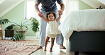 Home, first steps and dad with baby, celebration and bonding together with support. Walking, motor skills and father with toddler, kid or child development with growth, smile and learning with joy