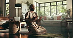 Islamic, prayer and muslim man on floor for worship, God and eid mubarak in living room. Salah, hope and Ramadan prostrate with spiritual person praying on home mat for faith, religion and gratitude