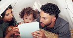 Tent, kid and parents with tablet in home for educational app, streaming service or watching cartoon together. Fairy lights, people and bonding with baby in blanket fort for connection, love and care