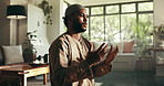 Home, prayer and Muslim man for religion, worship and praise to Allah in living room. Religious faith, fasting and Islamic person on mat for Ramadan Kareem, salaah and praying for peace in morning