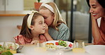 Kids, girl and whisper for gossip with lunch for secret, healthy food and nutrition meal. Smile, family and talk for rumor with salads for bonding together, parent listening and share story at house