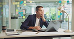Bored, laptop and thinking with business man at desk in office for planning or problem solving. Computer, depression and ideas with person in workplace for compliance, management or research