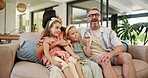 Parents, children and happy with singing on sofa with care, love and bonding in living room at family home. People, mother and father with kids, girl and dance for game, connection and hug in house