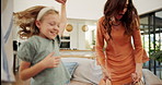 Dance, love and energy with family in living room for bonding, support and care. Happiness, jumping and trust with parents and children in lounge of home for holding hands, music and smile together
