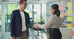 Business people, handshake and meeting with partnership for teamwork, greeting or planning together at office. Businessman, woman or colleagues shaking hands with smile for thank you at workplace