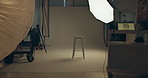 Lighting, stool and studio set for photography with media session for magazine project. Equipment, chair and background for creative editorial, design or photoshoot with empty space at art agency.