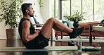 Health, fitness and man with sit ups in house for morning workout in living room with challenge. Sports, balance and person with training routine for core strengthening exercise on yoga mat in home.