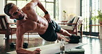 Plank, fitness and man in home, exercise or core strength for muscle in apartment, balance or training. Stretching, healthy and person with abs in house, workout or routine for posture in living room