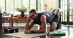 Man, fitness and break with mat for workout, exercise or intense training on floor at home. Tired, male person or rest with water or dumbells for pilates, sweat or recovery in living room at house