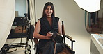 Woman, photographer and camera for face in studio for photoshoot results, editing or catalog. Photography, digital and retouch process in backstage to review picture, production and magazine industry