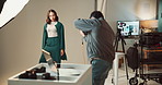 Photography, studio and photographer with model on set for magazine cover, about us or creative career. Media, production and female person with behind the scenes for fashion photoshoot with agency.