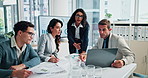 Business people, laptop and coaching with screen for analytics, meeting or performance review at office. Group, employees or training staff with statistics, graph or chart for market growth or profit