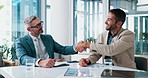 Happy, businessmen and handshake with partnership for deal, agreement or teamwork at office. Male people, employees or colleagues shaking hands with smile for business opportunity or meeting together