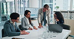 Businessman, laptop and coaching with screen for analytics, meeting or performance review at office. Group, employees or training staff with statistics, graph or documents for market growth or profit