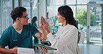 Doctors, woman and man with tablet, high five or happy for solution, goal and feedback at clinic. People, surgeon and talking on touchscreen for app with cheers, congratulations or thanks at hospital
