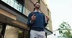 Business man, phone and celebration in city, deal and excited on mobile app with low angle in street. Person, smartphone and win with fist pump, smile and cheers for goal on urban sidewalk in Italy