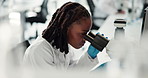 African woman, microscope and study with science at laboratory, studying and medical breakthrough. Person, tools and lens for zoom, bacteria and process for virus, vaccine and pharmaceutical drugs