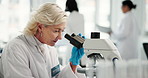 Science, lab and mature woman with microscope for research, medical study and discovery. Healthcare, pharmaceutical and scientist with equipment for vaccine, microbiology and experiment for medicine