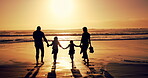 Family, sunset and holding hands with kids at beach for summer vacation, travel trip and bonding. Back, parents and walking with children on ocean for tropical holiday, weekend journey and adventure