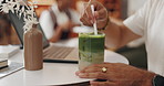 Hands, straw and man in cafe with matcha for morning drink with freelance creative project on laptop. Stir, computer and male journalist with ice green tea latte for energy boost in coffee shop.