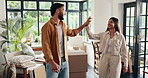 Boxes, happy and couple high five in new home for property, moving day and investment. Homeowner, real estate and man and woman celebrate for mortgage success, house purchase and rental apartment