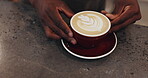 Man, barista hands and coffee art in restaurant, hospitality service and ceramic presentation with milk. Beverage, creative process and latte culture on counter, waiter and pattern shape in cafe