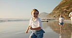 Smile, child and running for fun on beach for catching game, energy and bonding of summer vacation. Girl, family and playful with ocean activity, tropical holiday and travel adventure of getaway trip