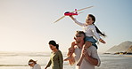 Parents, children and toy plane at beach, happy and playful with bonding, summer and mockup space in sky. People, mom and dad with kids, games and fun with flight, airplane and holiday in Australia