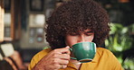 Morning, drinking and man with coffee in cafe for relax on weekend morning in restaurant. Calm, happy and male person enjoying cup of organic chai, matcha or tea latte in diner for energy on break.