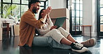 Moving, happy and couple high five with tablet in new home for mortgage investment, renovation support or planning. Real estate, people and celebration on floor for property success or relocation app
