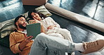 Boxes, tablet and couple on carpet, conversation and relax in living room with new property. Love, apartment and man with woman, tech and digital app for real estate, internet or renovation in lounge