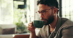 Home, couch and man with coffee to drink, espresso and comfortable on weekend in living room. House, male person and aroma in morning for hot cappuccino, beverage and relax with caffeine on sofa