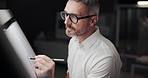 Man, architect and drawing with building, board and lines with creativity, editing and night at company. Mature person, engineer and paper with writing, sketch and project management at agency