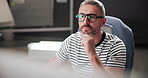 Business, thinking and man in workplace, computer and planning for project, creativity and copywriting. Person, employee and internet with pc and network with research for article and design editing