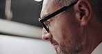 Business, drawing and man with glasses, deadline and illustration for project management. Employee, night and professional in workspace, eyewear and design editing with ideas and artistic expression