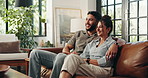 Happy, watching TV and couple relax on sofa for movies, film and series on streaming subscription in home. Love, dating and man with woman on couch for entertainment, bonding or videos in living room