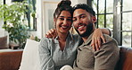 Home, couch and face of couple for hug, bonding together and healthy marriage with love in lounge. Laughing, man and woman in portrait for relax, commitment and affection in relationship joke on sofa