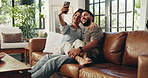Couple, selfie and happy with hug on sofa, care and connection with love for post on web in living room. People, man and woman with embrace, photography and smile for social media on couch at house