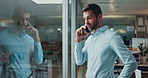 Sales, talking and businessman with phone call, financial negotiation and advice in agency. Night, service or consultation for insurance client with mobile, overtime and discussion for life cover