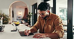 Laptop, typing and man in home office for writing on accounting document, remote work or review revenue. Computer, freelance auditor and financial report online, smile and bookkeeping with profit