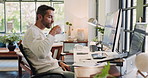 Computer, coffee and face with man in home office for remote work or startup business. Administration, design and smile with freelance employee drinking caffeine beverage in apartment to relax