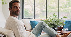 Face, relax or man with smile in living room for ambition, realtor career and development of housing business. Portrait, home or person with property consultant, real estate agent or mortgage listing