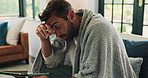 Thermometer, sick and man with tablet in home for fever, influenza or cold medical symptoms. High temperature, technology and male person with online telehealth consultation on sofa in living room.