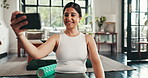 Girl, phone and texting in home, fitness and smile for post on web with mobile app, training and chat on break. Woman, smartphone and happy with notification, exercise and social media at apartment
