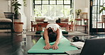 Woman, yoga and stretching with laptop for online class, tutorial or fitness lesson on mat at home. Female person, yogi and warm up with water break for technology tips, holistic steps or zen pilates