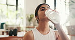 Home, woman and yoga with water to drink, hydration and wellness break for exercise in apartment. Face, female person and self care with bottle for nutrition, detox and fitness with h2o for health