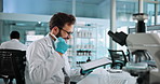 Man, scientist and tablet for success in lab with good news, medical research and vaccine results. Male person, fist and microscope with online report, healthcare achievement and celebrate promotion