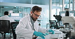 Science, research and man in lab, chemistry and liquid for experiment, testing and studying disease. Person, scientist or employee in workplace, pipette or biotech for cure, sample or medical results