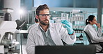 Computer, scientist and man with chemical in beaker for medical inspection in lab at night. Chemistry, biotechnology and science worker with sample in glass for research, test and cure development